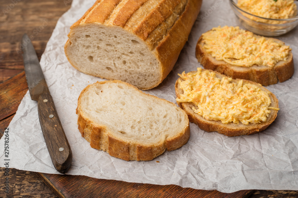 Cooking a grated cheese sandwich with garlic on a piece of white loaf. Cooking Snacks Cooking a grated cheese sandwich with garlic on a piece of white loaf. Cooking Snacks
