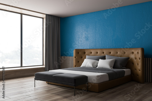 Blue and wooden bedroom corner