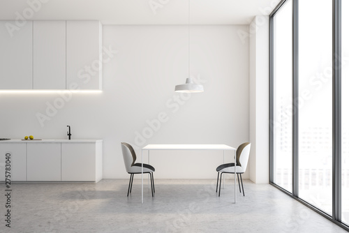 White loft kitchen interior with table
