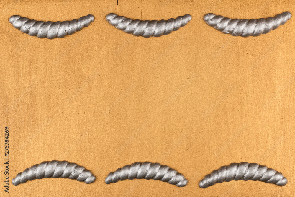Obraz premium Gypsum cornice, stucco, moldings, friezes on a gold background, copy space.