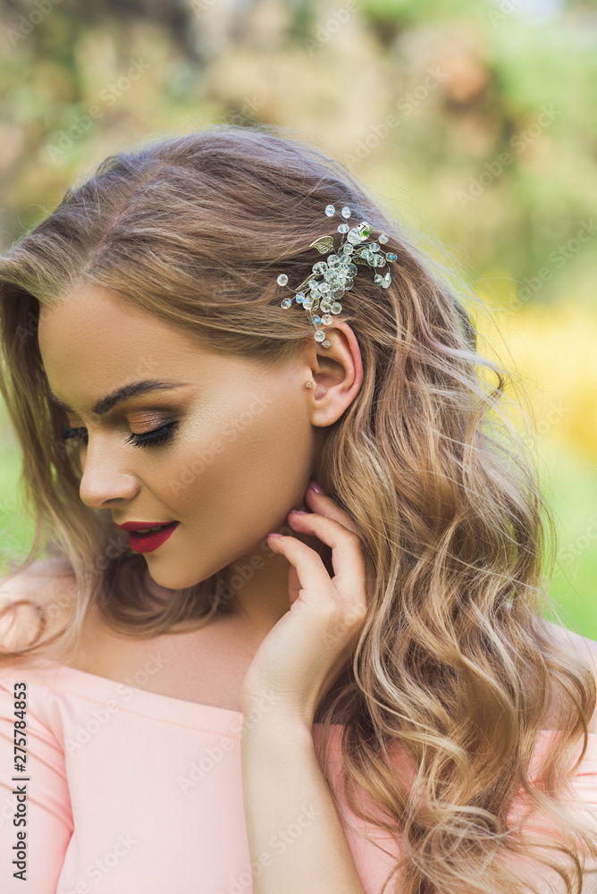 Beautiful woman with modern hairstyle and hair jewelry Beautiful woman with modern hairstyle and hair jewelry