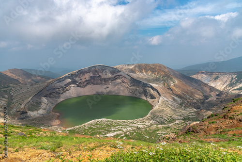 Beautiful view of Okama crater lake at Mount Zao in summer sunny day. active volcano in Miyagi Prefecture, Japan