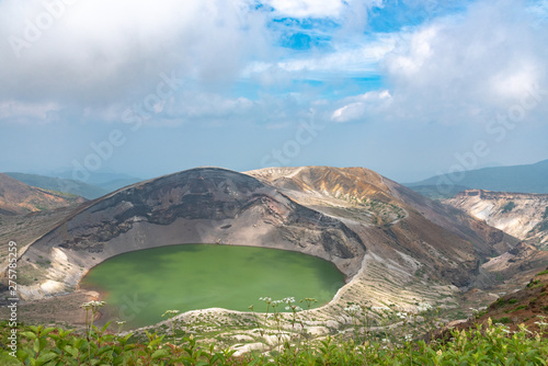 Beautiful view of Okama crater lake at Mount Zao in summer sunny day. active volcano in Miyagi Prefecture, Japan