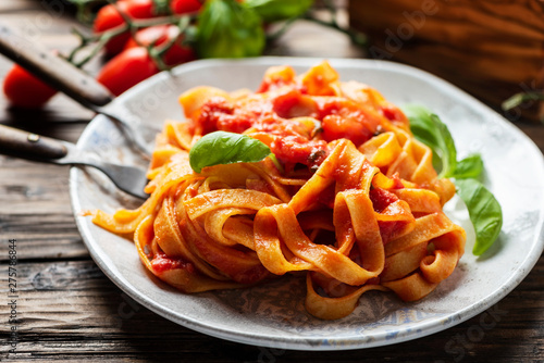 pasta fettuccine with tomato and basil photo