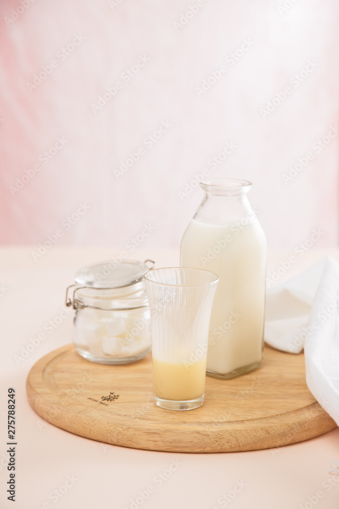 fresh milk in glasses with sugar cubes fresh milk in glasses with sugar cubes