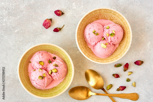 Strawberry rosewater ice cream , frozen yogurt with pistachio and rosebud. Top view