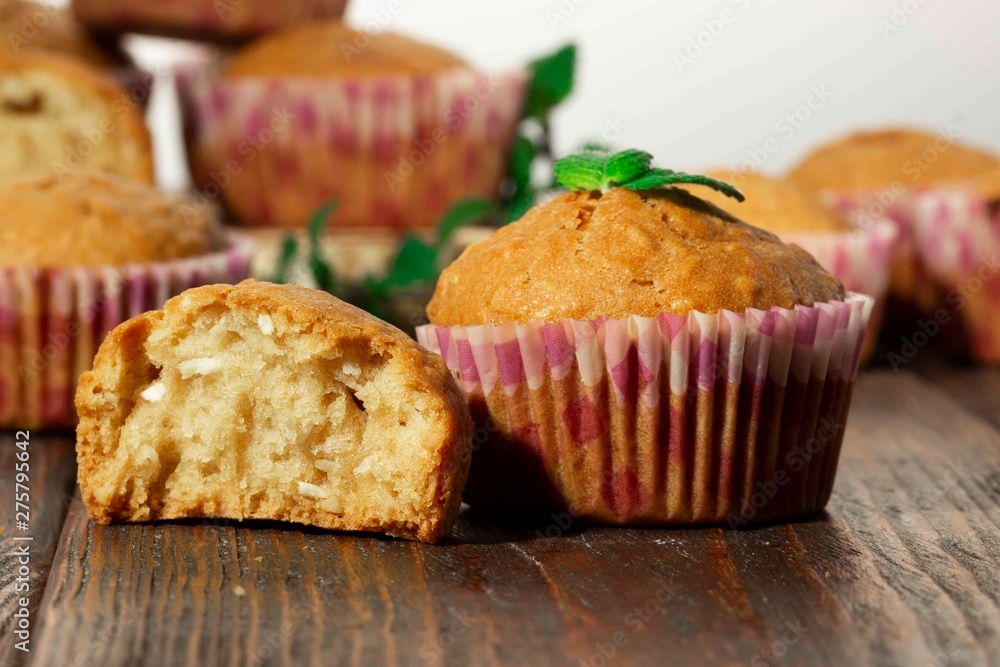 Vanilla cupcake, homemade pastry on wooden background Vanilla cupcake, homemade pastry on wooden background