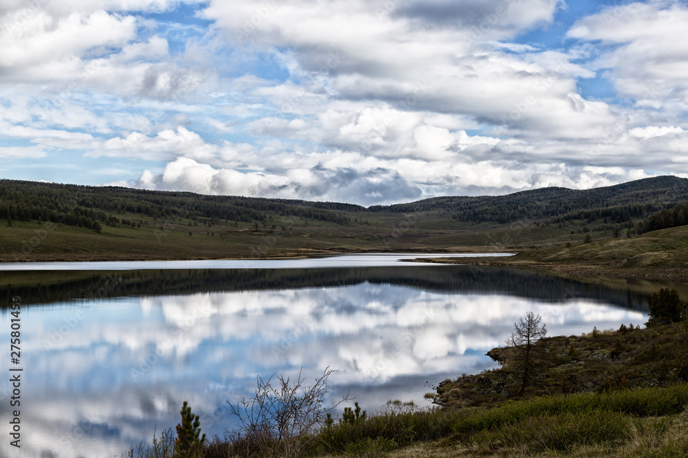 Mountain lake landscape with beautiful sky and clouds Mountain lake landscape with beautiful sky and clouds