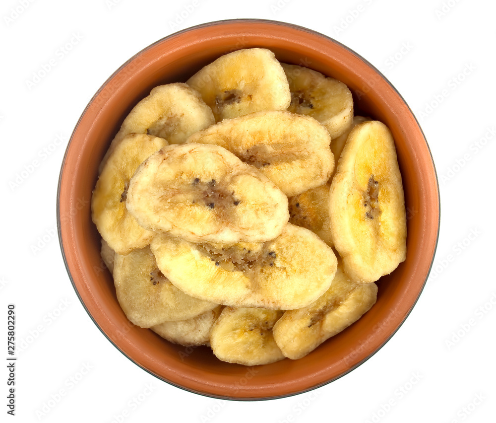 Banana chips in bowl on white background