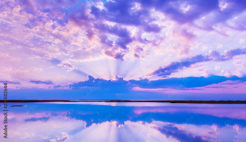Beautiful scenery with colorful sky, beautiful water reflectioncloud, clouds and sunbeams.Artistic picture. Beauty world. Panorama