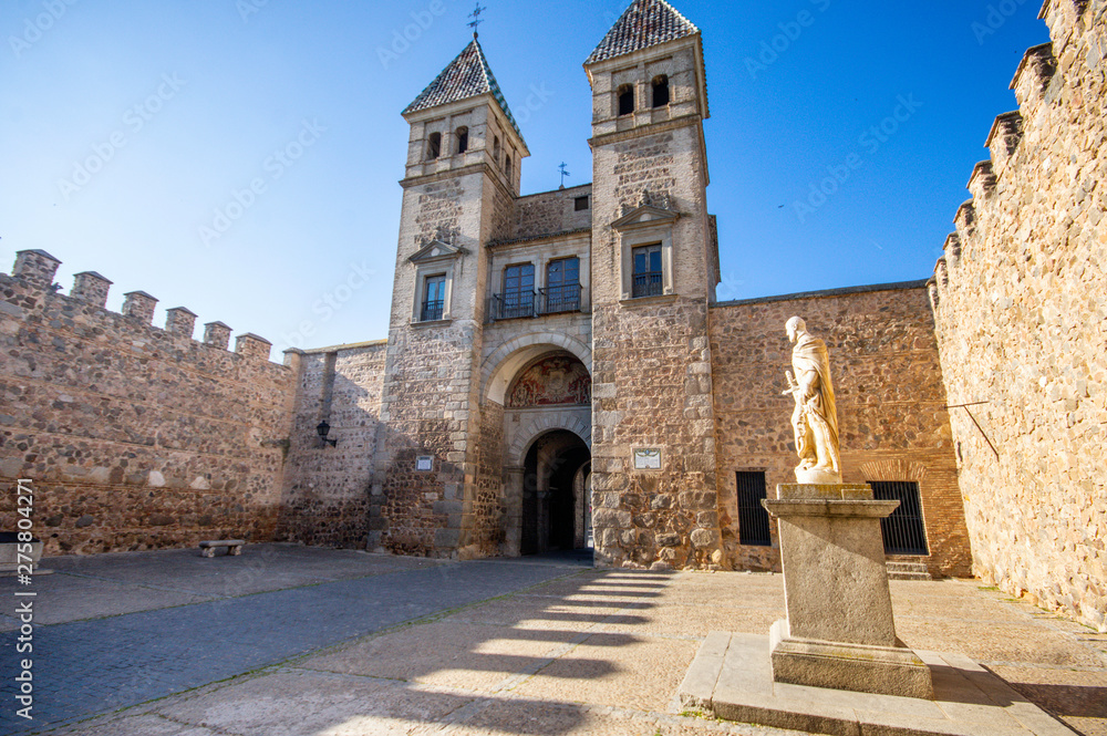 internal view of puerta bisagra with statue at toledo, spain - english translation : bisagra gate