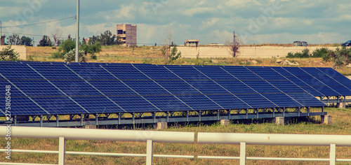 Фотография Solar panels are abreast in the summer. Selective focus.