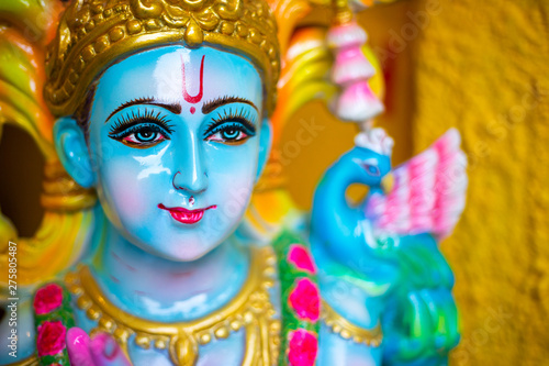 Fototapeta Naklejka Na Ścianę i Meble -  Statue of Hindu god Krishna in high glossy paint