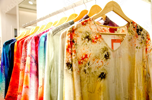 Indian women kurtis or lehanga on a rack for sale at a clothing store photo