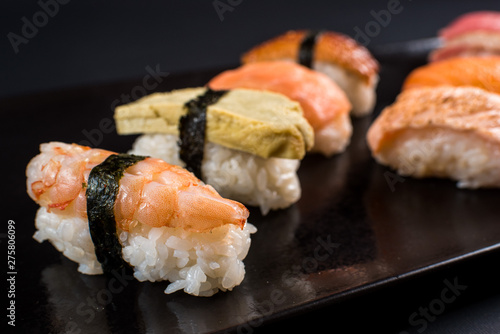 sashimi sushi set on black background