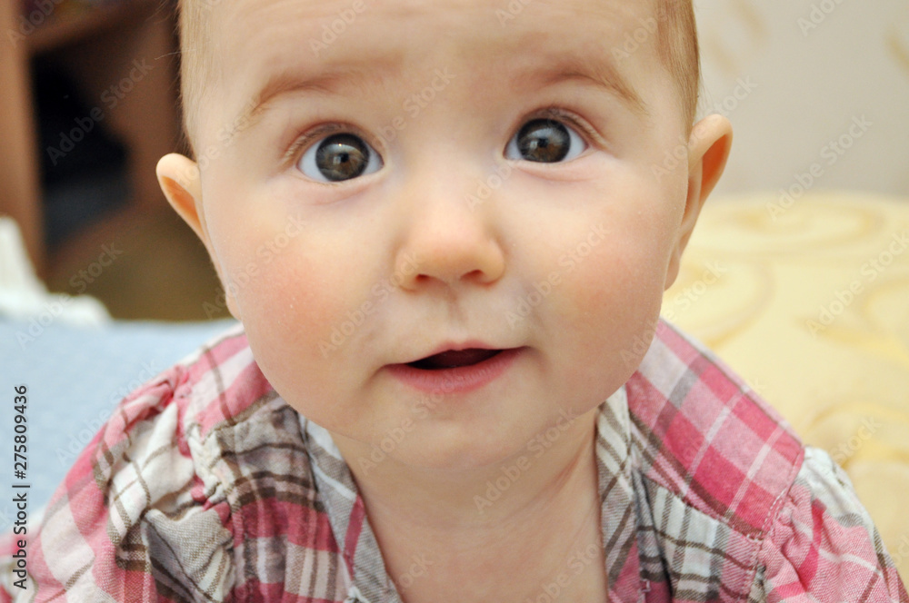 One year old Child portrait of surprised girl One year old Child portrait of surprised girl