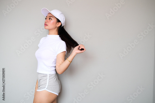 Asian girl in sportswear with cute expression.