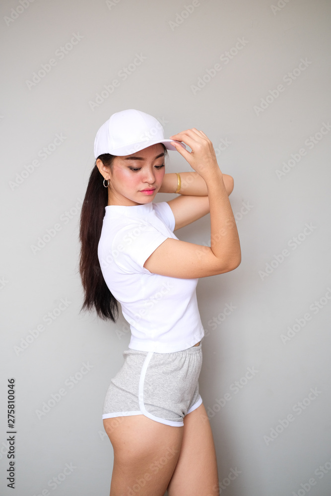 Asian girl in sportswear with cute expression. Asian girl in sportswear with cute expression.