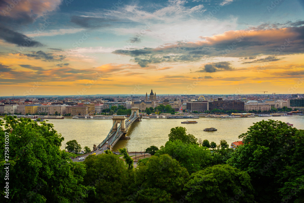 Budapest, Hungary: Beautiful landscape of the city, the bridge and the Danube river at sunset. Panorama top view from the hill to the old town.