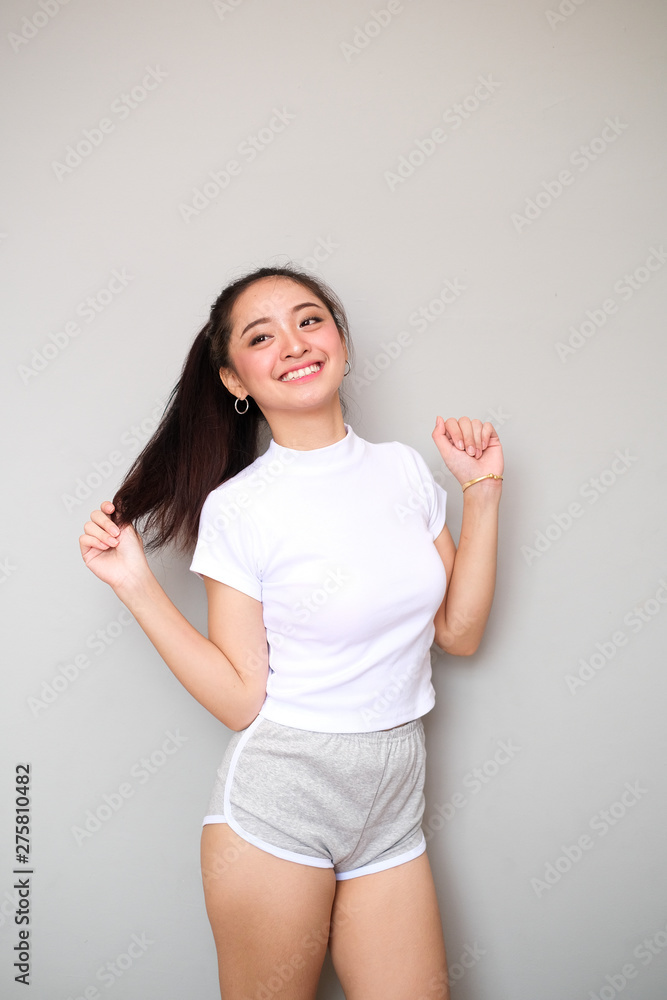 Asian girl in sportswear with happy expression. Asian girl in sportswear with happy expression.