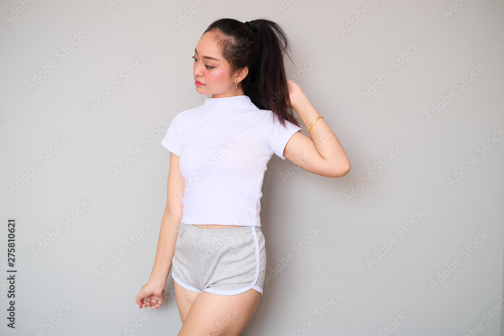 Asian girl in sportswear with cute expression. Asian girl in sportswear with cute expression.