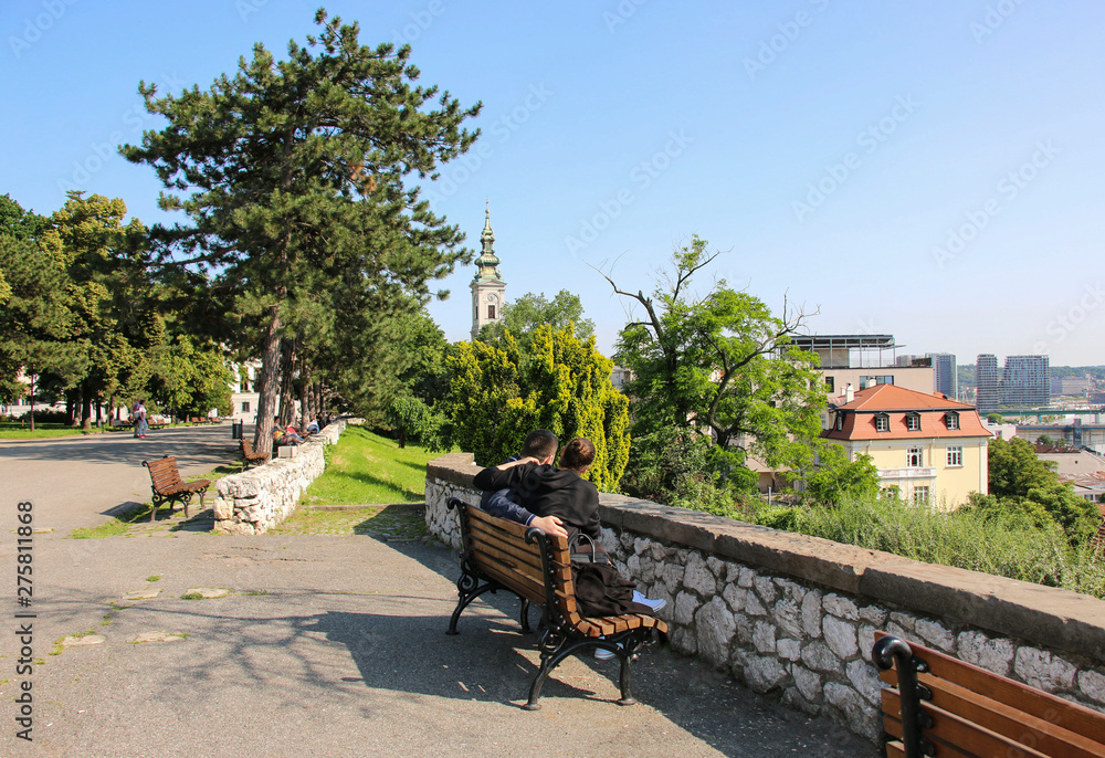 Young man and girl enjoying their time together in sunny day in Kalemegdan fortress, Belgrade, Serbia.