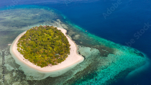 Mantigue Island  Philippines. Tropical island with white sandy beach and coral reefs. Seascape  view from above.