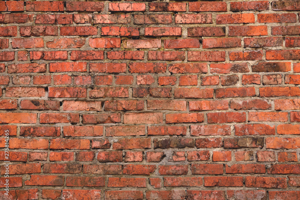 Obraz premium Old brick wall weathered and broken bricks, background