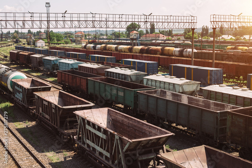 Freight trains on city cargo terminal. Railways in train parking. Arain arrived at the station. Cargo train platform with freight train container at depot in port use for export logistics background. photo