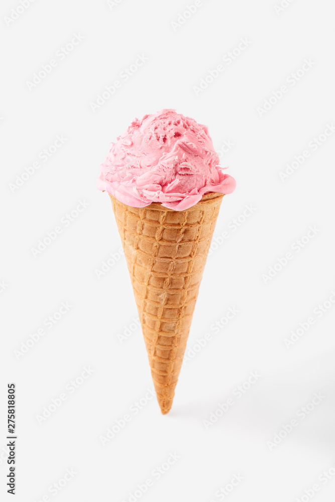 pink ice cream ball in a Waffle Cone on a white Background. Fruit ice cream in a waffle cone. pink ice cream ball in a Waffle Cone on a white Background. Fruit ice cream in a waffle cone.
