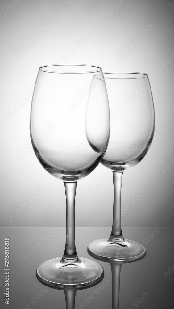 Two transparent wine glasses isolated on white background