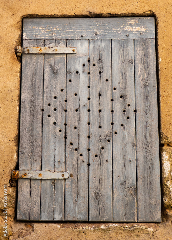 old wooden door with openwork decoration old wooden door with openwork decoration
