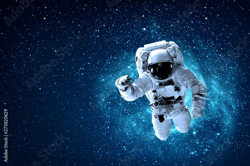 Fototapeta Naklejka Na Ścianę i Meble -  astronaut flies over the earth in space