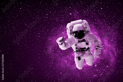 astronaut flies over the earth in space © vovan