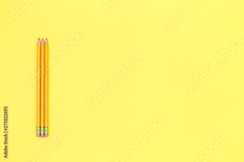 Pencils on a yellow background. Back to school concept. Horizontal