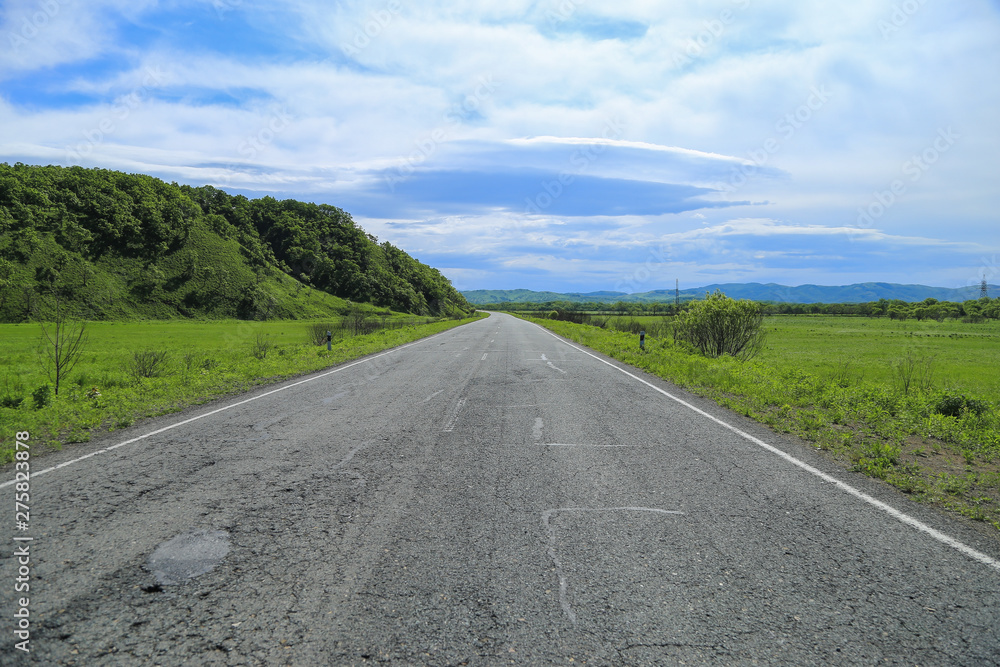 Desert asphalt road and summer landscape