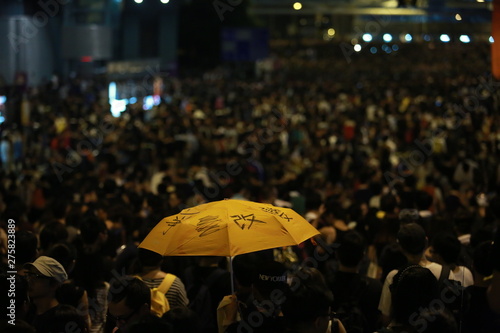 Photography holding the umbrella which the word mean change on it in Admiralty, 2014 umbre