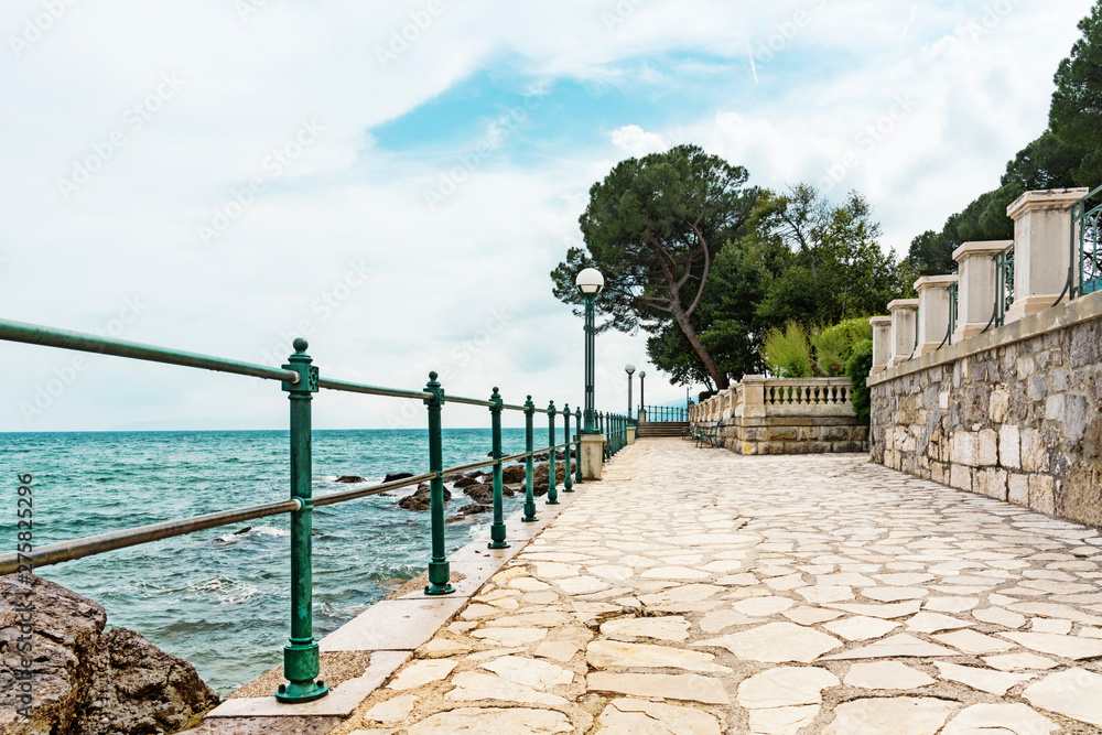 Fototapeta premium boulevard with fence and pavement along the Adriatic Sea, Opatija, Croatia