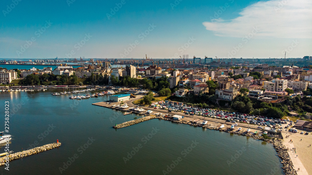 Aerial view of port and old town in Constanta, tourist and industrial town and popular resort in Romania. Aerial view of port and old town in Constanta, tourist and industrial town and popular resort in Romania.