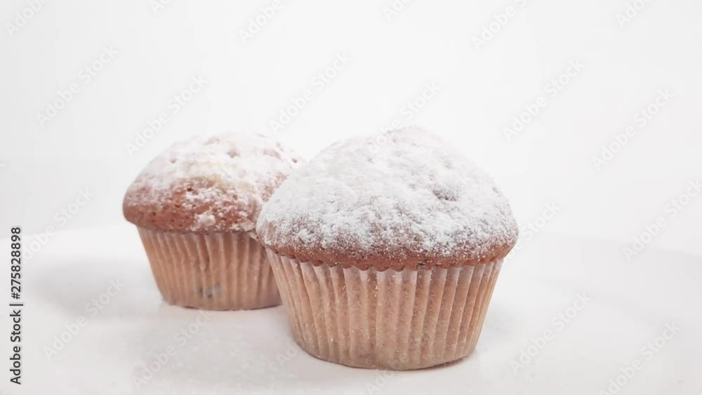 fragrant cake sprinkled with powdered sugar. slow motion fragrant cake sprinkled with powdered sugar. slow motion