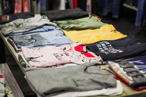 different women's shirts sold in a clothing store