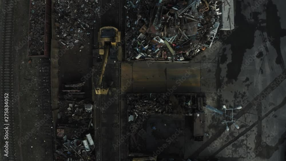 Metal recycle factory, Magnetic Backhoe use electromagnets crane keeping metal.color vintage style.Aerial view Metal recycle factory, Magnetic Backhoe use electromagnets crane keeping metal.color vintage style.Aerial view