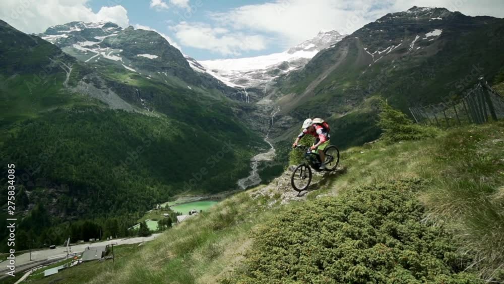 Pan Right to Left: Mountain Biking Down the Mountain of Val Poschiavo Switzerland Pan Right to Left: Mountain Biking Down the Mountain of Val Poschiavo Switzerland
