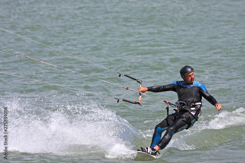 kitesurfer riding his board