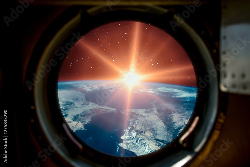 Sunrise, view from spaceship. Elements of this image furnished by NASA.