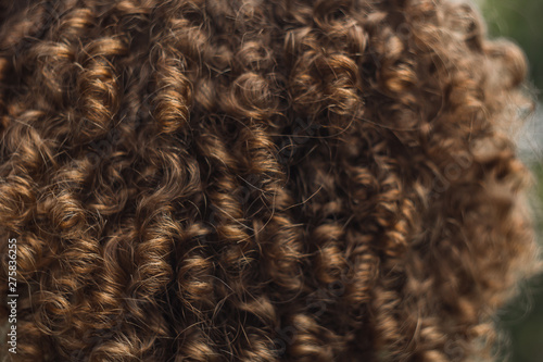 texture of male curly hair close up. perm for men. stylish hairdo