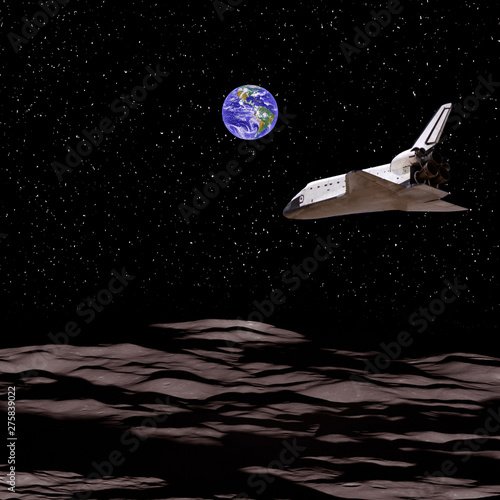 Space mission to the alien planet.  Shuttle flies above the planet landscape. The elements of this image furnished by NASA. photo