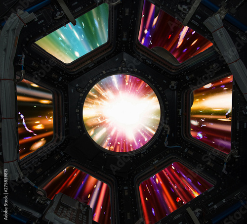 Fototapeta Naklejka Na Ścianę i Meble -  Hyper jump in in window of spaceship. Elements of this image furnished by NASA.