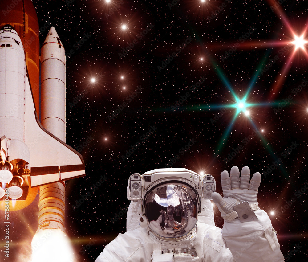 Big rocket (shuttle), waving astronaut and galaxy on the backdrop. The elements of this image furnished by NASA. Big rocket (shuttle), waving astronaut and galaxy on the backdrop. The elements of this image furnished by NASA.