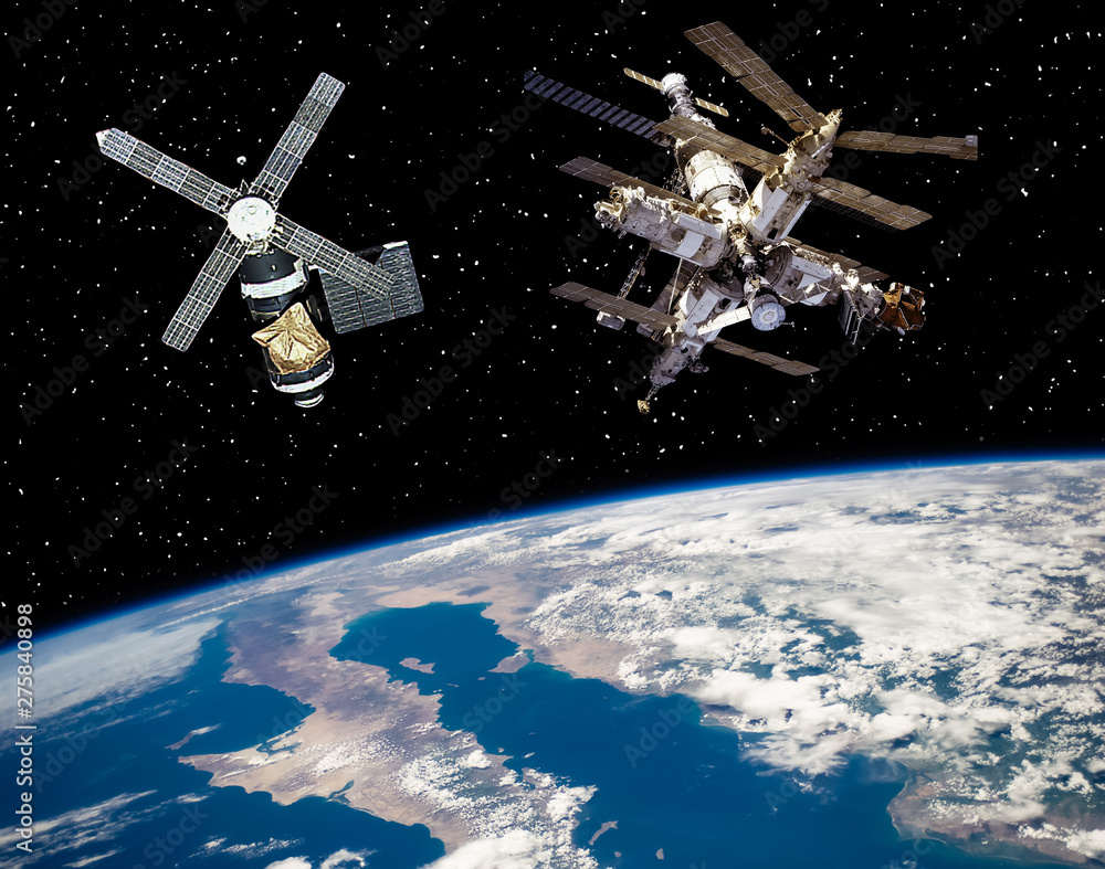 Two space stations above the earth. The elements of this image furnished by NASA. Two space stations above the earth. The elements of this image furnished by NASA.